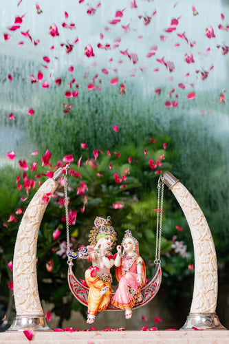Fancy Radha Krishna on Swing with Synthetic Ivory Tusks