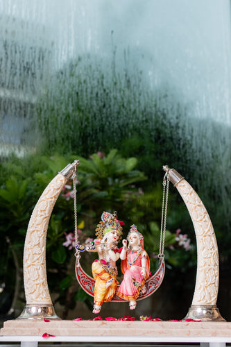 Fancy Radha Krishna on Swing with Synthetic Ivory Tusks